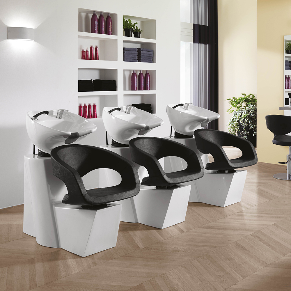 Wave washing unit with white base and black chair